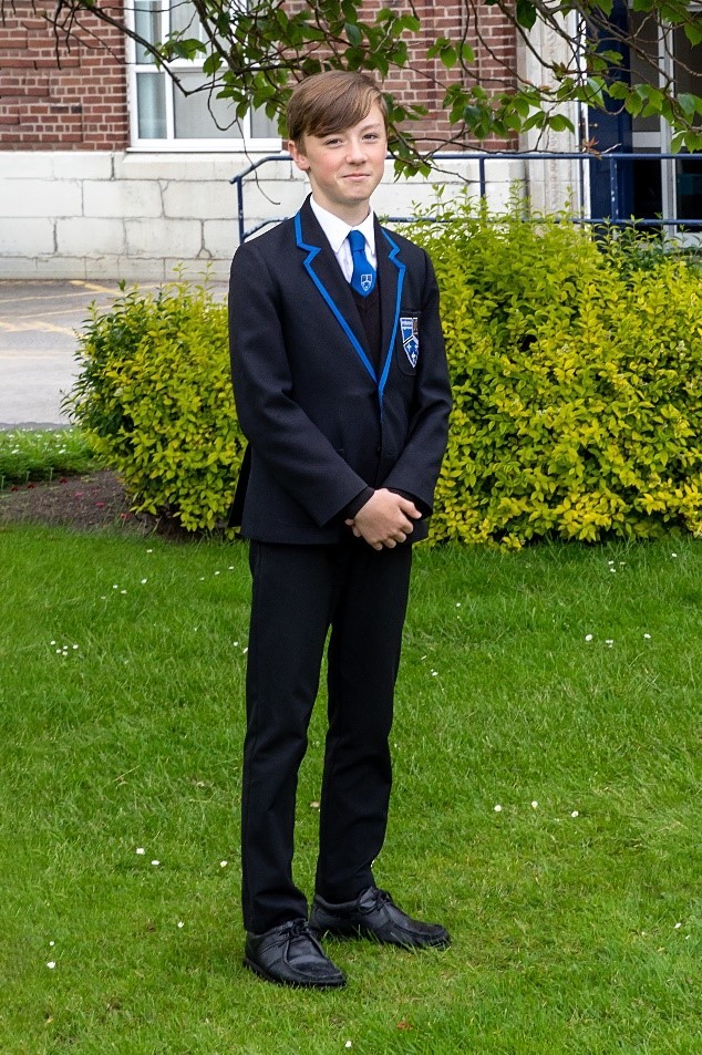 Portrait Of Male Elementary Pupil On White Stock Photo - Download Image Now  - School Uniform, Boys, Child - iStock